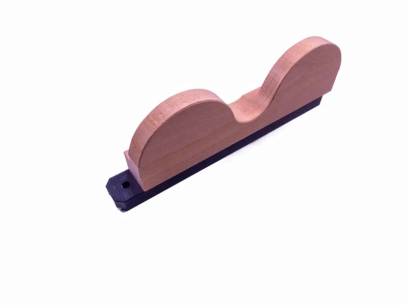 Druckschuh mit doppelter Auflage (559) aus Holz, zwei gebogene Spitzen, schwarze Basis, bietet hohe Stabilität im Arbeitsschutz.